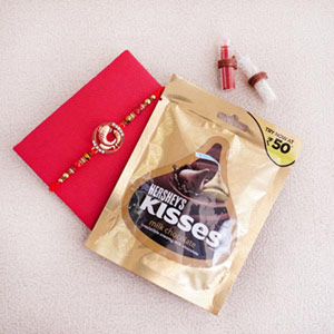 Golden Rakhi and Kisses Hershey&#39;s Milk Chocolates 