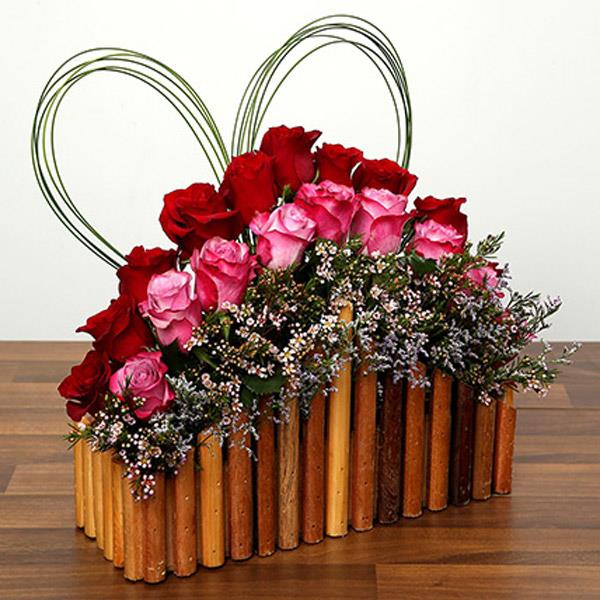 Send Red and Purple Roses In A Wooden Base Online