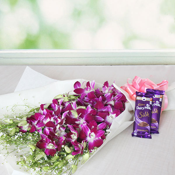 Send Purple Orchids Bouquet with Cadbury Silk  Online