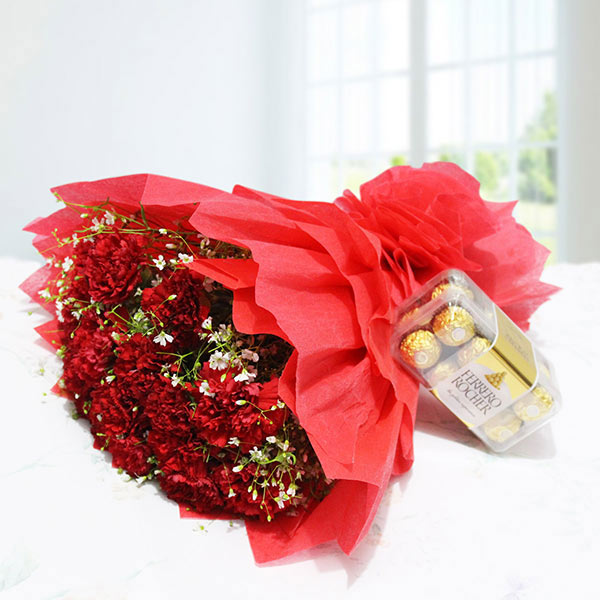 Send Scintillating Red Carnations with Chocolates Online
