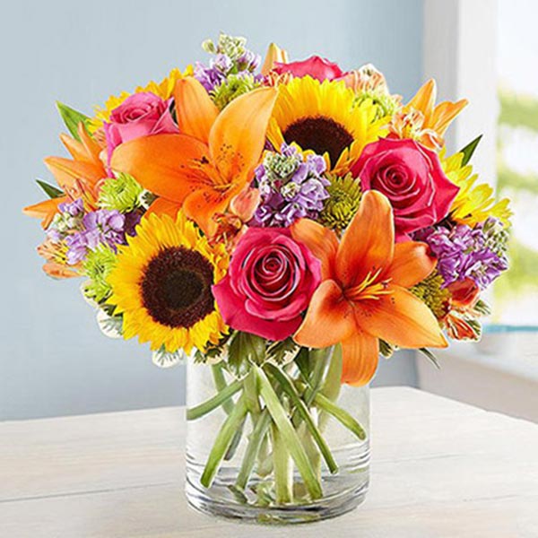 Send Vivid Bunch Of Flowers In Glass Vase Online