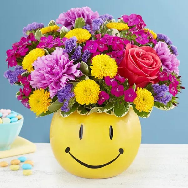 Send Bright Flowers in Ceramic Smiley Face Vase Online