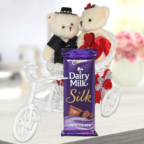 Send Cute Couple in Cycle with Chocolate Online