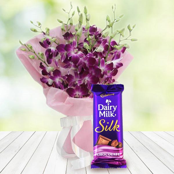 Send Blissful Orchid Flower Bouquet with Chocolate Online