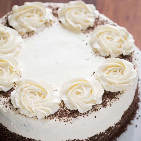 Send Chocolate Cake with Floral Topping Online