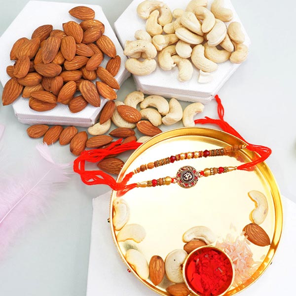 Send Two Rakhis with Nut Lounge Dry Fruits N Puja Thali Online - RKH22 ...