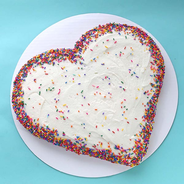 Send Vanila Heart Shape Cake with Rainbow Sprinkles Online